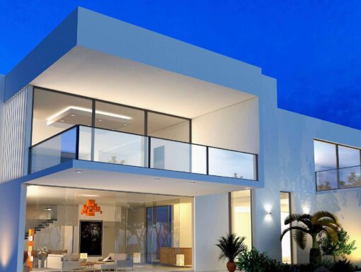 A modern house with a balcony and patio.